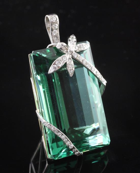 An 18ct white gold and diamond mounted large green paste pendant, 46mm.